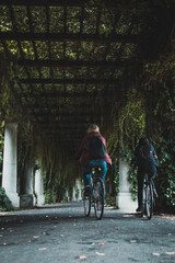 pergola alley in the summer, cycling women