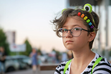 teen girl with colorful rainbow hair clips on city street, lgbt-theme, pride