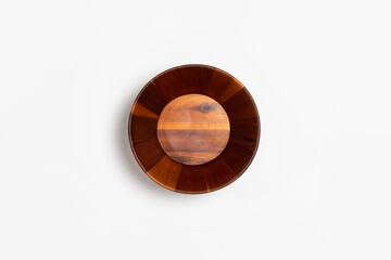 Wooden plate isolated on white background. High-resolution photo.Top view. Mock-up.Wooden bowl.