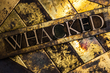 Whacked text on vintage textured grunge copper and gold background