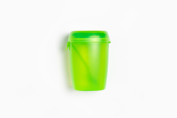 Plastic thermos cup with a spoon with freezer block isolated on white background.High-resolution photo.Top view. Mock-up.