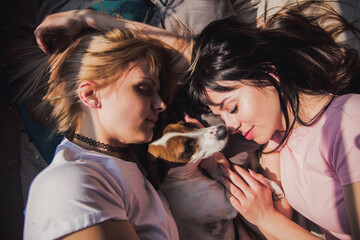 Lesbian couple blond and brunet woman sleep together