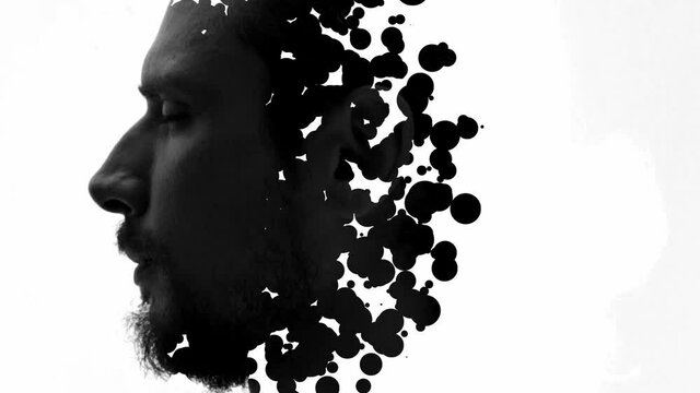 A black and white double exposure portrait of a man's profile combined with black brush strokes
