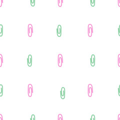 A pattern of decorative paper clips in pastel colors, pink on a white and green background is a minimal creative concept.