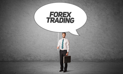 business person in casual holding road sign