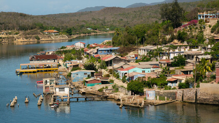 
Cuban poor colorful village with church on the hill near city Santiago de Cuba