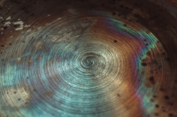Macro photo of corrosion and oxidation of metal. Bottom of the pan with rainbow steel colouration. Aged rusty industrial background, patina at damaged steel.
