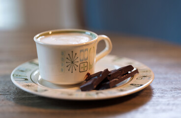 cup of coffee with frothy milk and chocolate