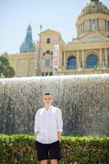  Barcelona in the afternoon, a beautiful view on a sunny day Montjuïc mountain. Man traveler posing