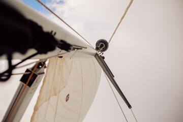 Sail on a sailing yacht beautiful against the sky