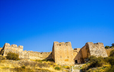 Naklejka premium castle of Acrocorinth above archaeological site of ancient Corinth, Peloponnese, Greece