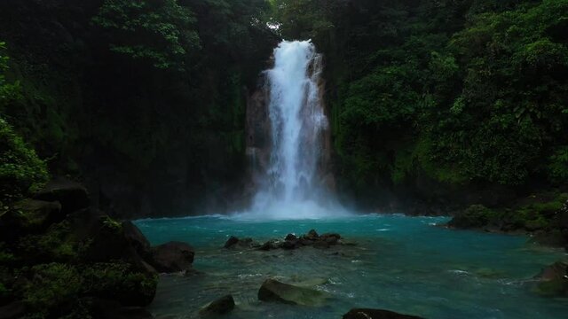 drone shot over the blue river  waterfall rio celeste Costa Rica 