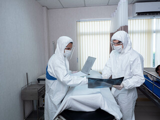 hospital clinic laboratory ward doctor scientist wear ppe white uniform Sick bed patient...
