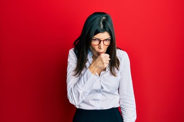 Young hispanic woman wearing business shirt and glasses feeling unwell and coughing as symptom for cold or bronchitis. health care concept.