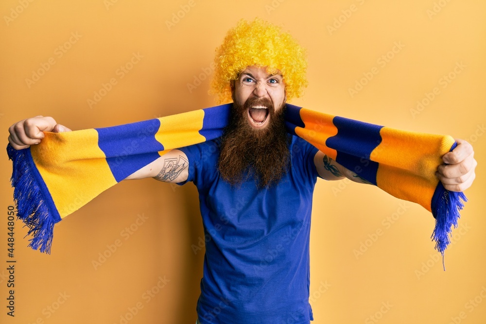 Canvas Prints redhead man with long beard football hooligan cheering game wearing funny wig celebrating crazy and 