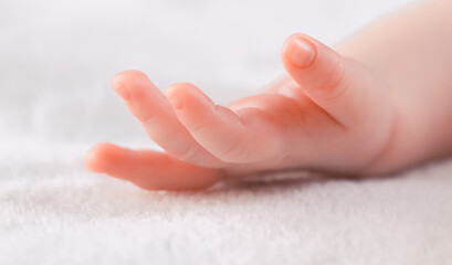 Caucasian newborn baby hand with fingers.
Caucasian baby hand of sleeping newborn baby with...