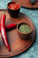 Pepper,paprika, basilik.Georgian food. Georgian spices on a plate.
