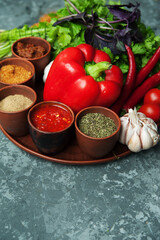 Pepper,paprika, basilik.Georgian food. Georgian spices on a plate.	