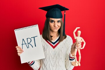 Young brunette girl graduated on art skeptic and nervous, frowning upset because of problem....