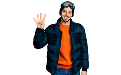 Young hispanic man with beard wearing snow wear and sky glasses showing and pointing up with fingers number four while smiling confident and happy.