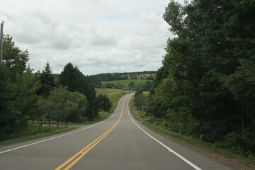 Long winding country road during the daytime 