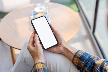 cell phone blank white screen mockup.woman hand holding texting using mobile on desk at office.background empty space for advertise.work people contact marketing business,technology