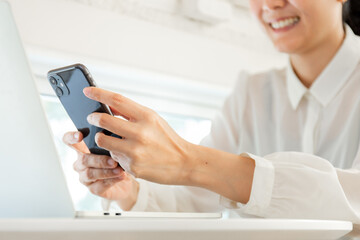 woman work using texting cell phone typing computer.student study education online learning.adult professional chatting on laptop,mobile contact us at Thinking business plan.connecting people concept