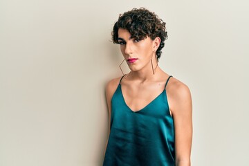 Young transgender man wearing make up and woman clothes, looking fashion and glamorous