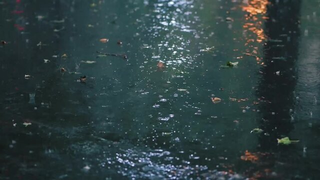 Hurricane downpour on a city street. Heavy rain with wind and a lot of precipitation. European climate. Summer evening. Cars and people in intense rain. Dnipro, Ukraine, circa July, 2021