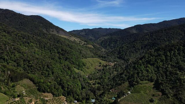 San Gerardo de Dota valley Costa Rica sunny day aerial green vegetation cloud forest landscape 
