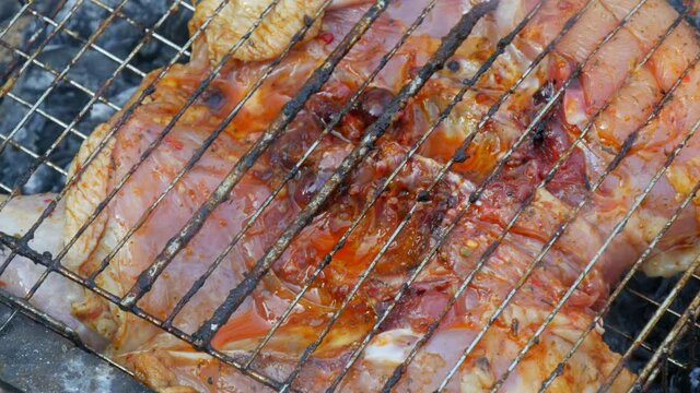 Whole juicy with spices grilled chicken tabaka or tapaka at summer picnic