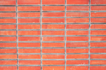 Brick wall texture with cracked tiles and cement. Classic brickwall surface background