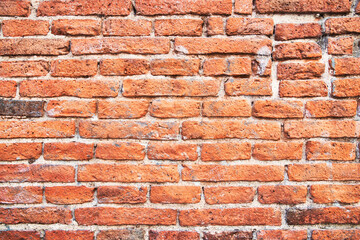 Fototapeta premium Brick wall texture with cracked tiles and cement. Classic brickwall surface background