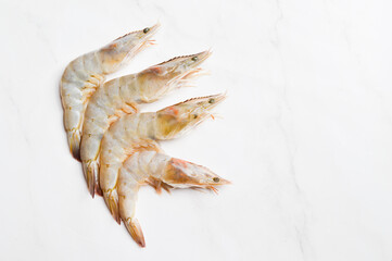 Raw fresh shrimps or prawns isolated on a white background