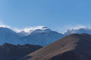 Snow and Wind on mountain peaks, Lone Pine Desert, California