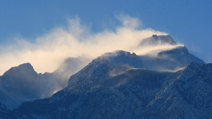 Naklejka na ściany i meble Snow and Wind on mountain peaks, Lone Pine Desert, California