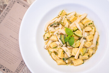 home made gnocchi with squid and sauce