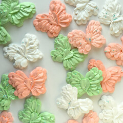 Stunning colored meringue butterflies in the form of flower petals - obrazy, fototapety, plakaty