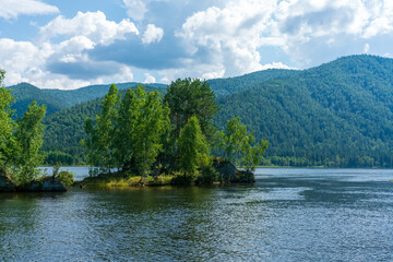 Fototapeta premium An island in the middle of the wide mountain river Yenisei