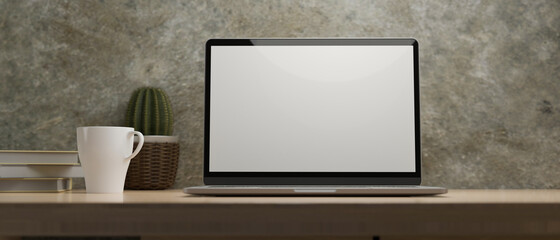 Laptop display for mockup on wood table at home office, cement wall
