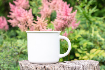 Mug mockup with bokeh green nature. Farmhouse rustic style. White coffee cup mock up. Blank mug printing design template.