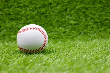 Baseball is on green grass