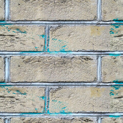Square seamless texture of the wall made of grey bricks and white cement between them
