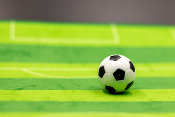 Soccer ball on green grass background