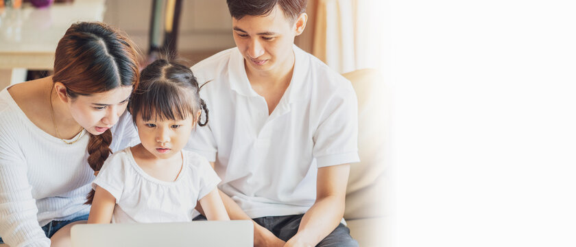 Banner photo of Asian family happy people concept - mother and father help their daughter do homework in living room