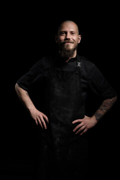 Portrait of a smiling brutal chef