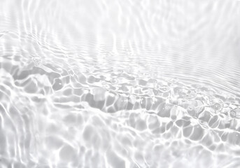 Transparent water surface with ripples and splashes. Summer water waves background in sunlight.