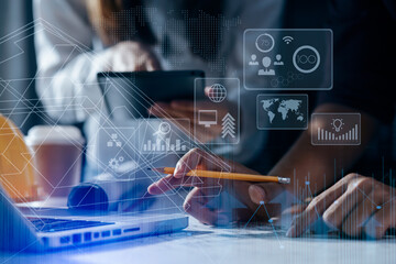 Construction and structure concept, engineer working with digital tablet computer and meeting for project working with partner on model building, technology network interface icons. 