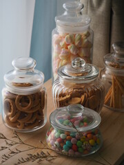 sweets and cookies in the glass jars