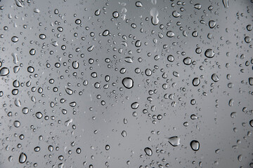 Water backgrounds with water drops. Blue water bubbles on window glass.
